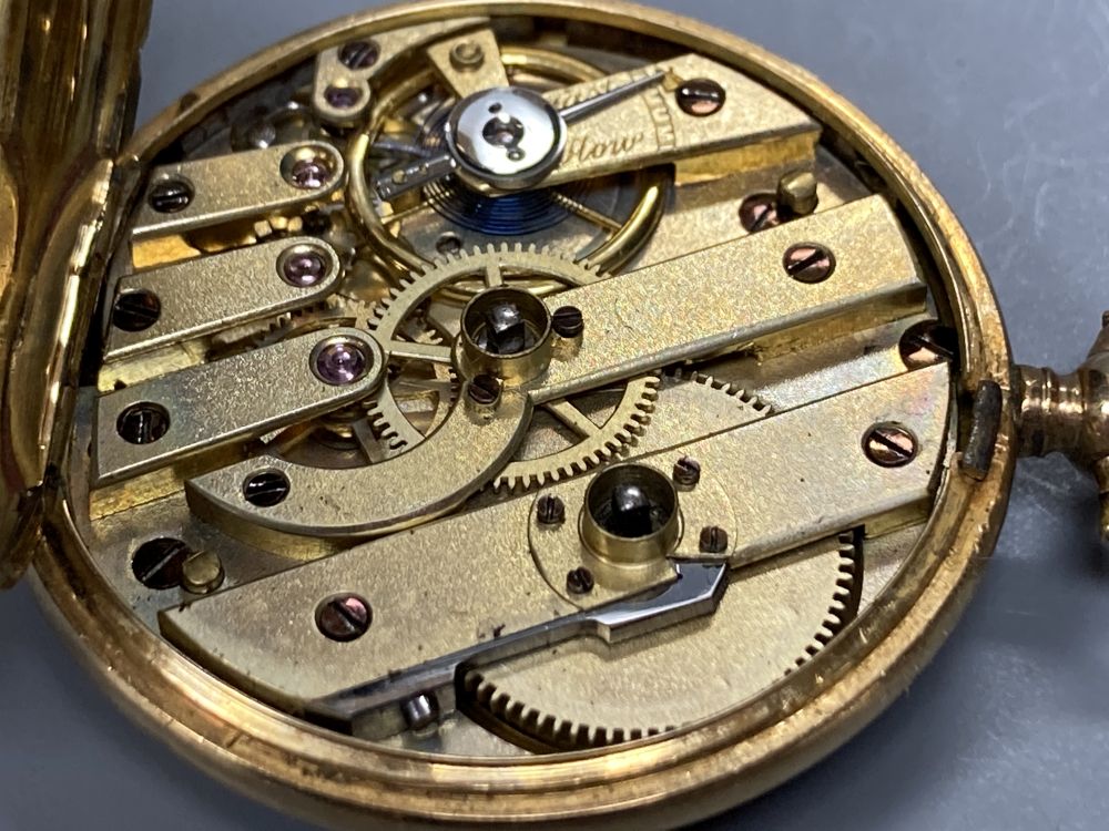 An early 20th century engine turned 18k and enamel(a.f.) keywind fob watch, case diameter 35mm, gross 29.2 grams.